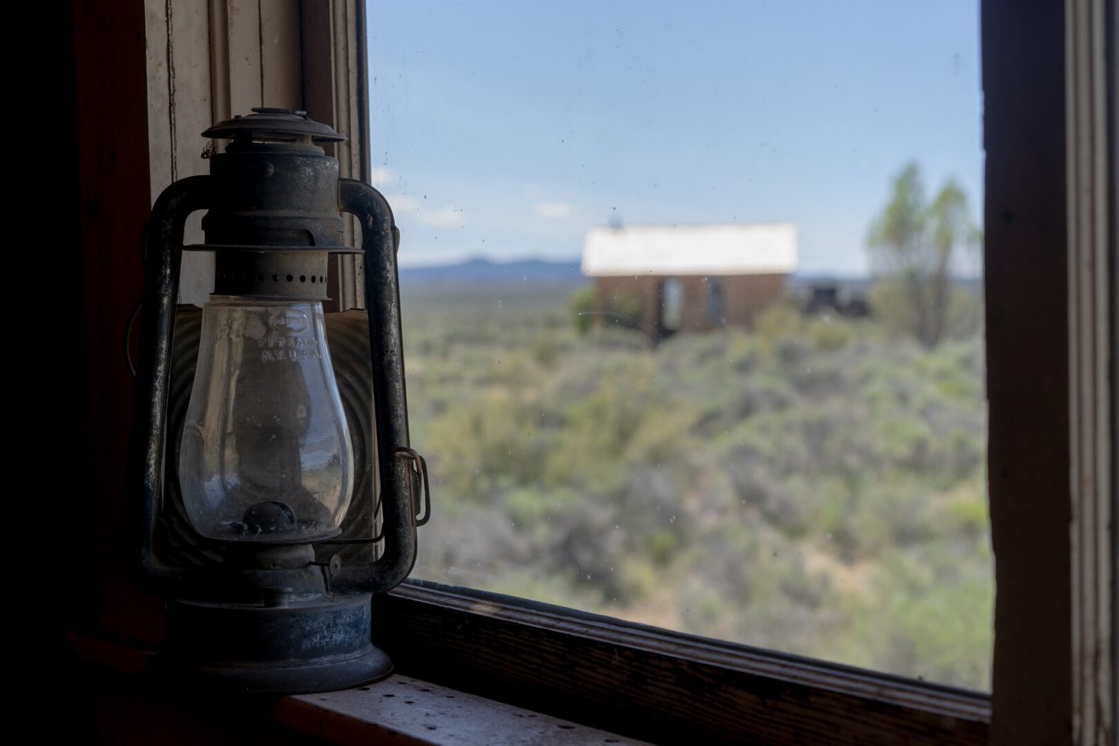 Gas lamp on a windowpane