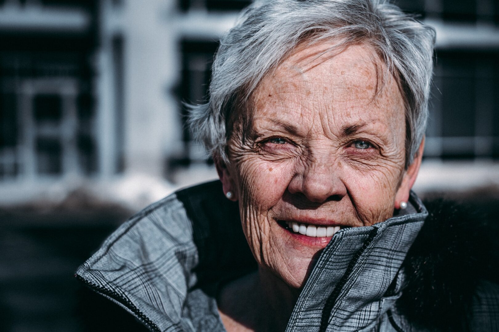 Chic elderly woman smiling
